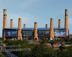 heatherwick studio plans birmingham stadium around twelve chimney-like towers