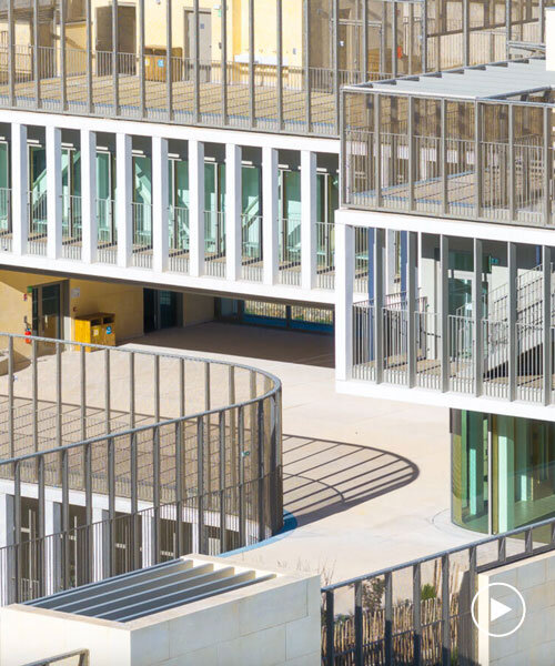 interlocking stone volumes sculpt layered school complex by brenac & gonzalez & associés