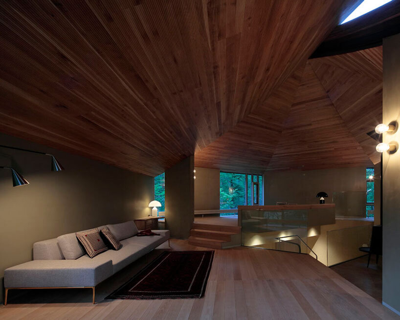 hexagonal wooden canopy crowns villa within moss garden in japan