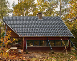 diagonally cut A-frame roof revives dutch holiday home by kumiki