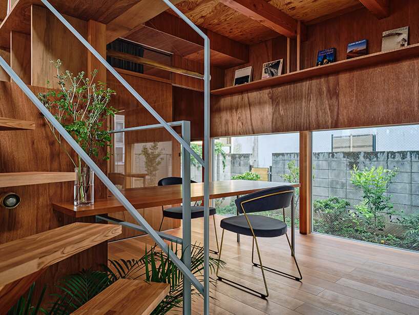 looping terrace arcs toward the street to bring daylight inside a tokyo dwelling by HOAA