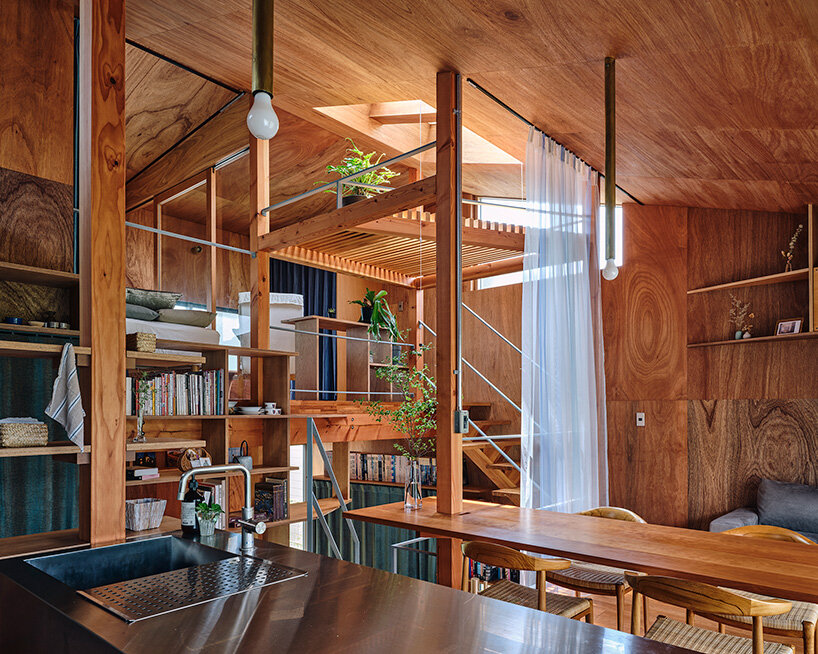 looping terrace arcs toward the street to bring daylight inside a tokyo dwelling by HOAA
