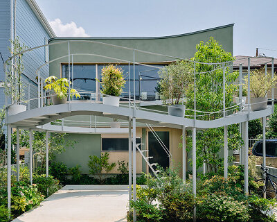looping terrace arcs toward the street to bring daylight inside a tokyo dwelling by HOAA