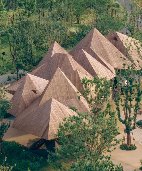 pyramidal volumes with wood strip patterns frame luxeisland restaurant by DL atelier