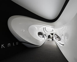 fluid black and white interiors connect curved mall corridors in tehran