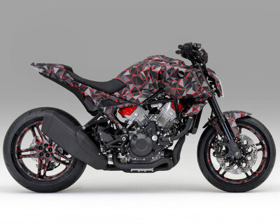 naked motorcycle by honda exposes the engine around the camouflage-wrapped frame