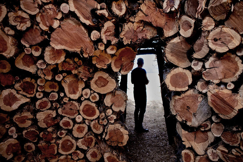 nomad studio's charred juniper ring marks the scar of a wildfire in northern spain