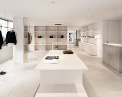 white-stained wood shapes soft bright interiors for tokyo apparel store