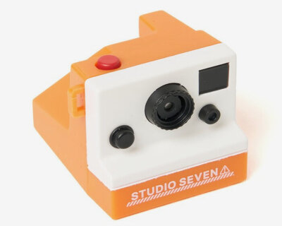 palm-sized retro digital toy camera hooks around belts or bags for portable picture-taking