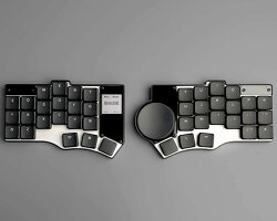 portable split keyboard with flat circular ‘mouse’ lets travelers type anywhere they go