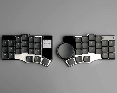 portable split keyboard with flat circular ‘mouse’ lets travelers type anywhere they go