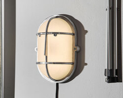 philippe tabet reimagines industrial bulkhead lamp as face-like lighting fixture