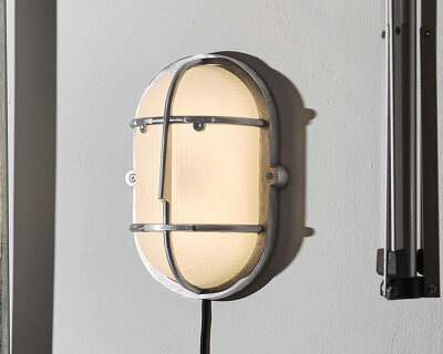 philippe tabet reimagines industrial bulkhead lamp as face-like lighting fixture