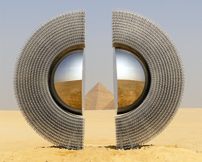 reflective aluminum sculpture by mert ege köse splits apart to frame the giza pyramids