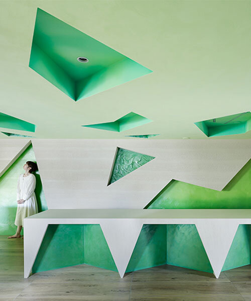 polygonal green cutouts animate kakushin tokyo office's interiors by moriyuki ochiai