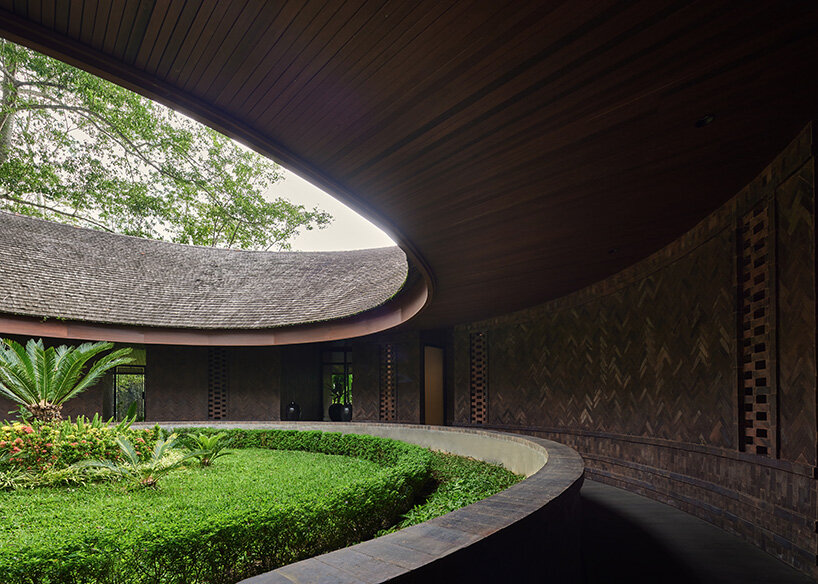 ring-shaped residence by alexis dornier wraps around verdant inner courtyard in bali