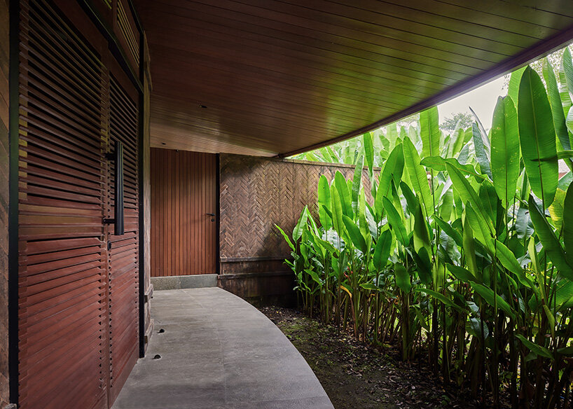 ring-shaped residence by alexis dornier wraps around verdant inner courtyard in bali