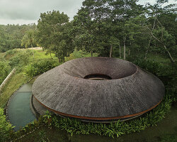 ring-shaped residence by alexis dornier wraps around verdant inner courtyard in bali