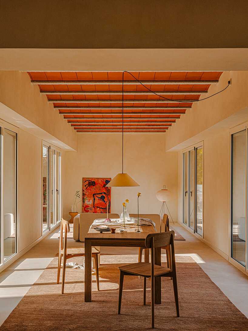 SIGLA studio organizes brick residence around two 'lungs' of light in spain