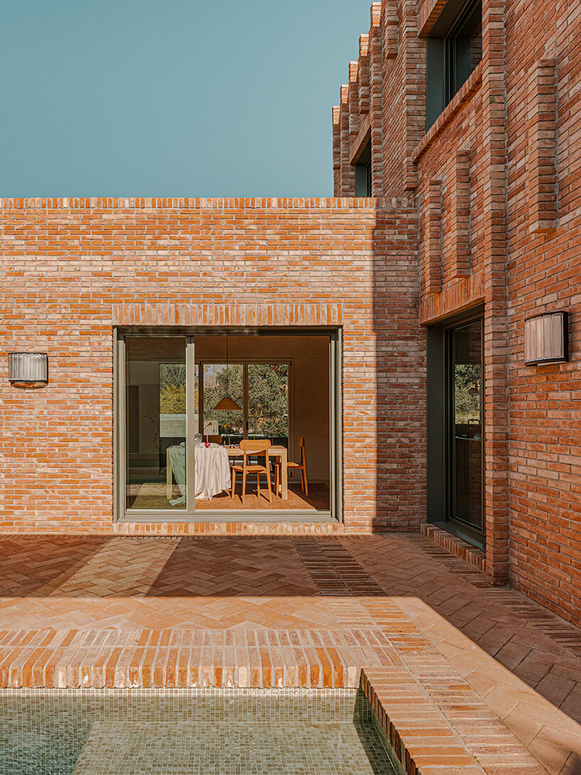 SIGLA studio organizes brick residence around two 'lungs' of light in spain