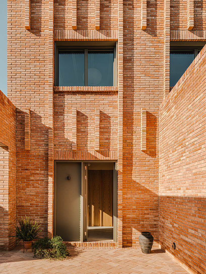 SIGLA studio organizes brick residence around two 'lungs' of light in spain