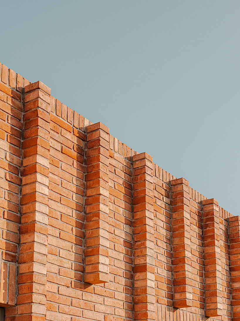 SIGLA studio organizes brick residence around two 'lungs' of light in spain