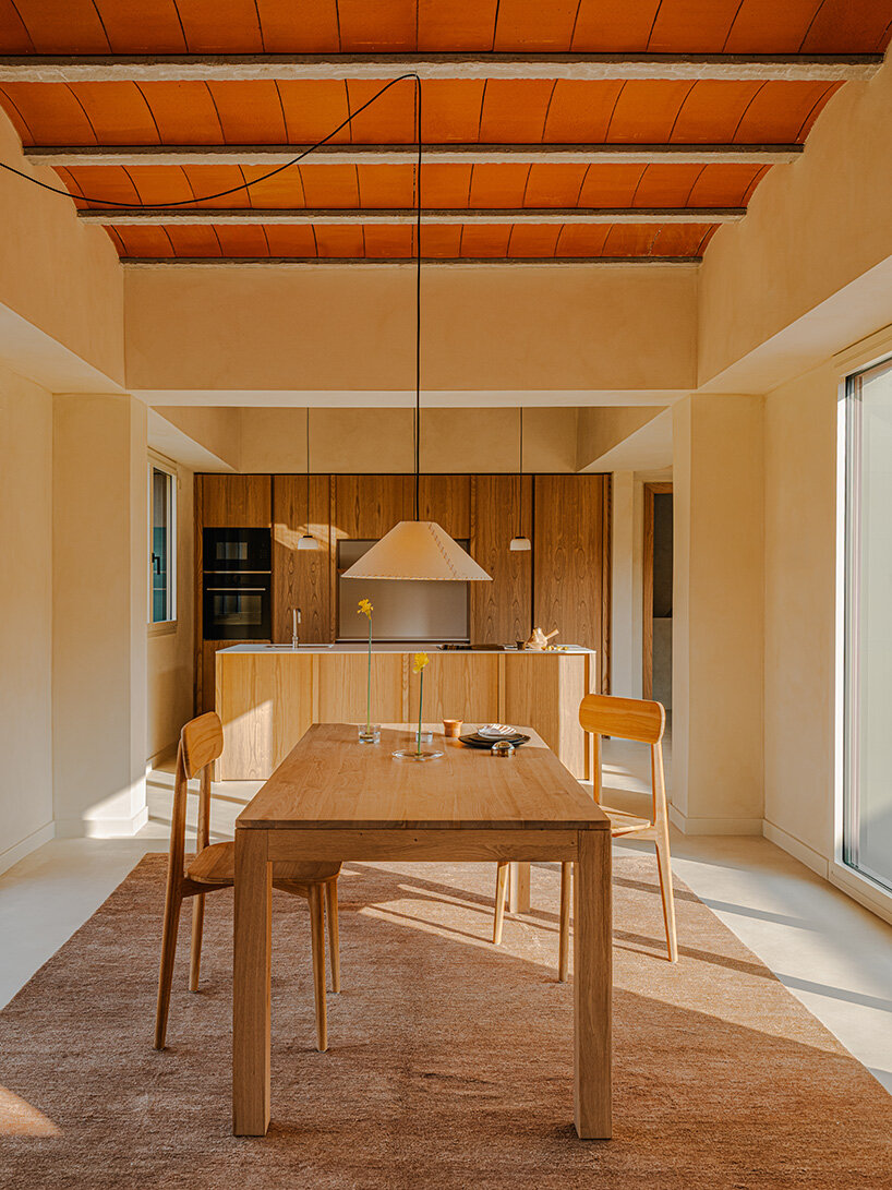 SIGLA studio organizes brick residence around two 'lungs' of light in spain