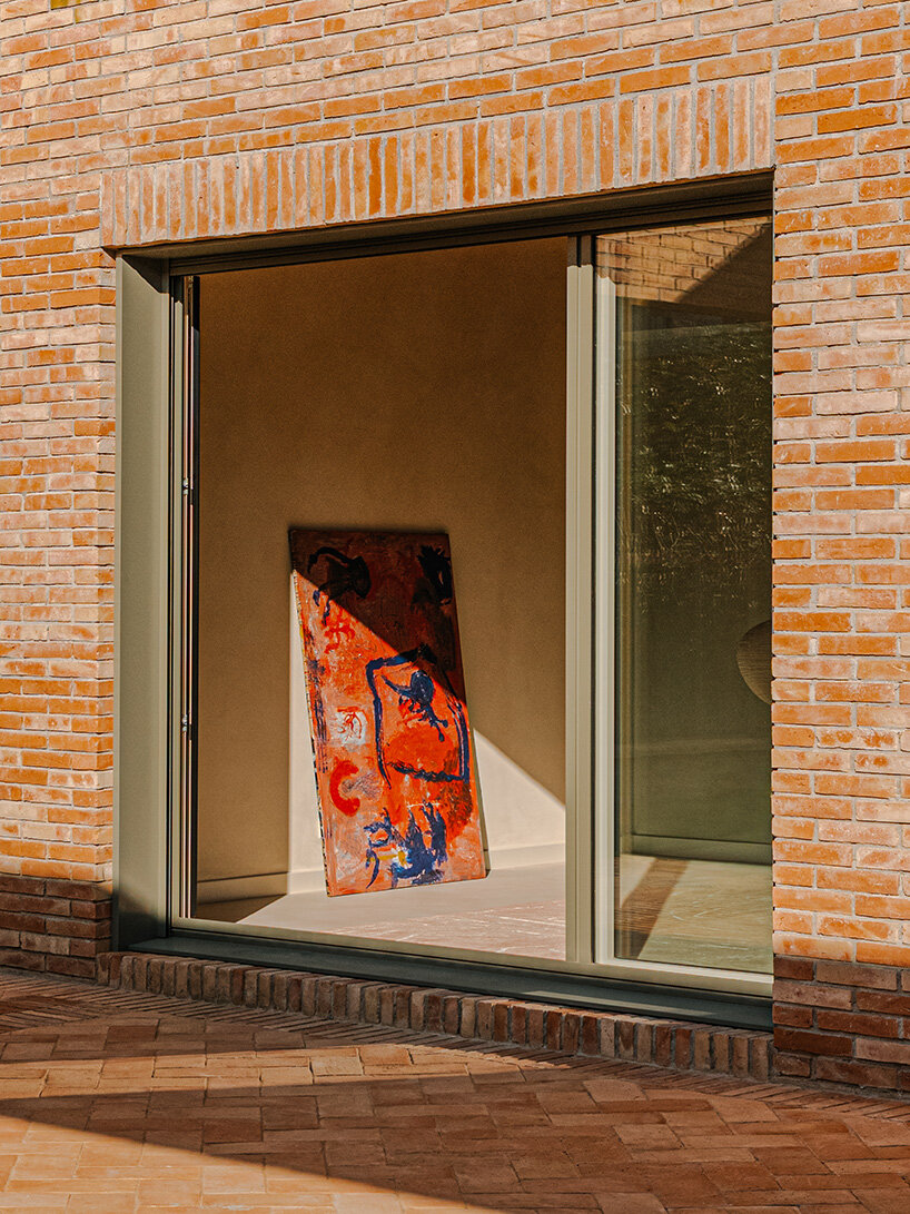 SIGLA studio organizes brick residence around two 'lungs' of light in spain