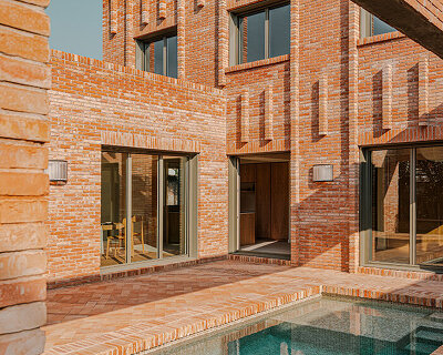 SIGLA studio organizes brick residence around two 'lungs' of light in spain