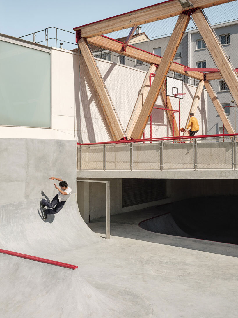 cantilever sports court crowns urban skatepark bowl along railway in france