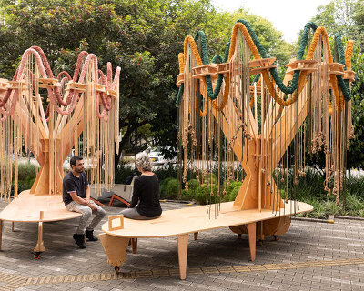 plywood and fabric solar tree installations offer shade in colombia's urban open spaces