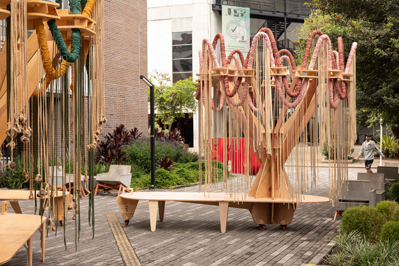 plywood and fabric solar tree installations offer shade in colombia's urban open spaces