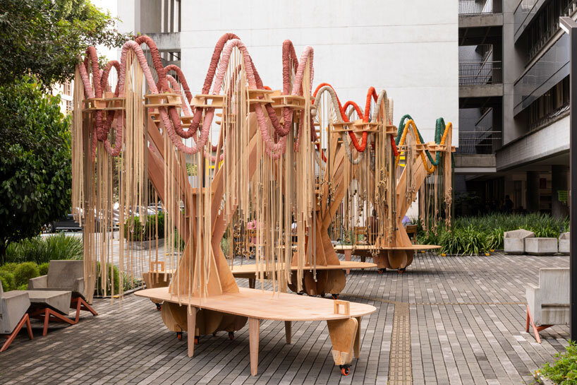 plywood and fabric solar tree installations offer shade in colombia's urban open spaces
