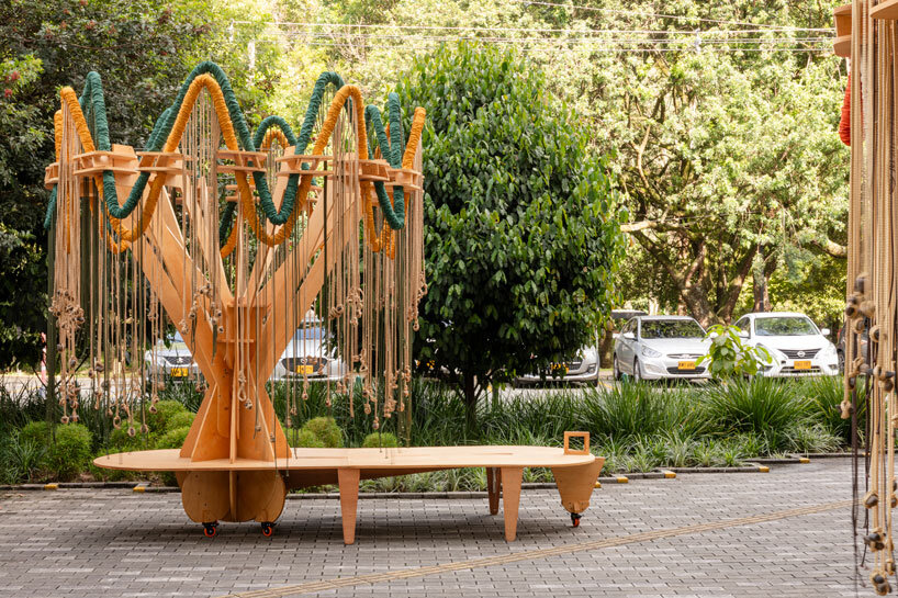 plywood and fabric solar tree installations offer shade in colombia's urban open spaces