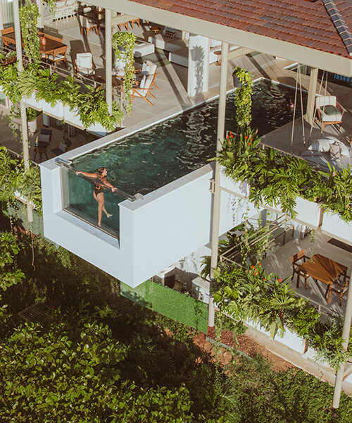 cantilevered swimming pool extends out from studio saxe's 'villa nuri' in costa rica