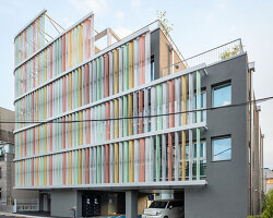 translucent facade of multicolored steel louvers unfolds along seoul’s dokkaebi market