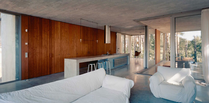 concrete columns lift residence above forested terrain in georgia