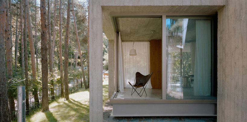 concrete columns lift residence above forested terrain in georgia