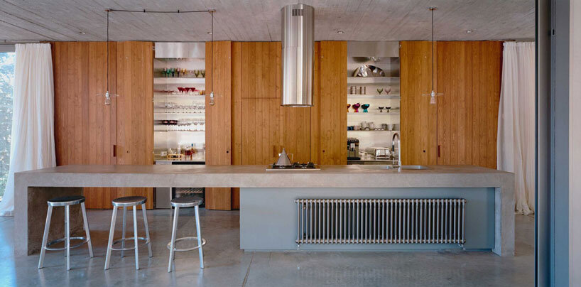 concrete columns lift residence above forested terrain in georgia