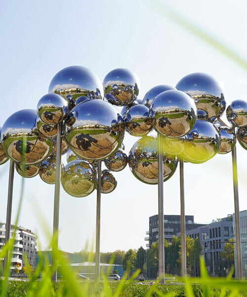 mirrored steel bubbles shape suspended kinetic sculpture by vincent leroy in normandy