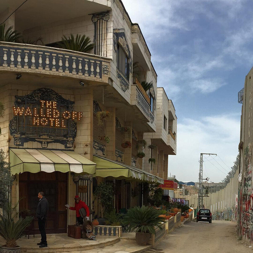 banksy's 'walled off hotel' reopens in bethlehem after two-year closure
