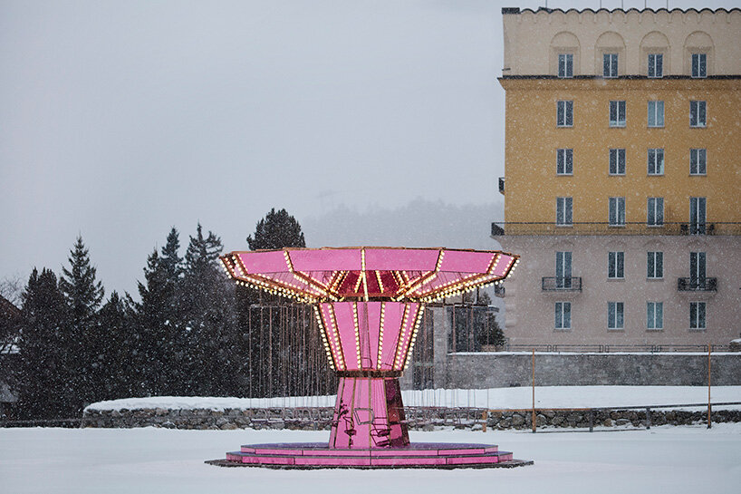 carsten höller's pink mirrored carousel slows time on the ice rink of the kulm hotel st. moritz