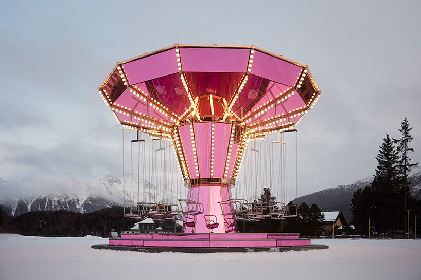 carsten höller's pink mirrored carousel slows time on the ice rink of the kulm hotel st. moritz