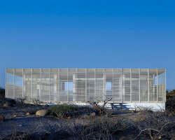 white louvers craft perforated facade filtering daylight within casa nada’s interiors in mexico