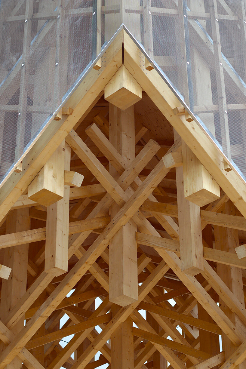 crystalline timber canopy inspired by snow fractals becomes a gathering space in finland