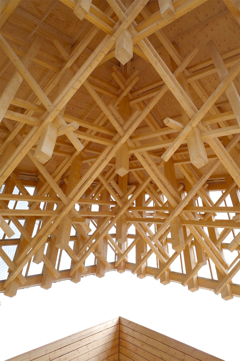crystalline timber canopy inspired by snow fractals becomes a gathering space in finland