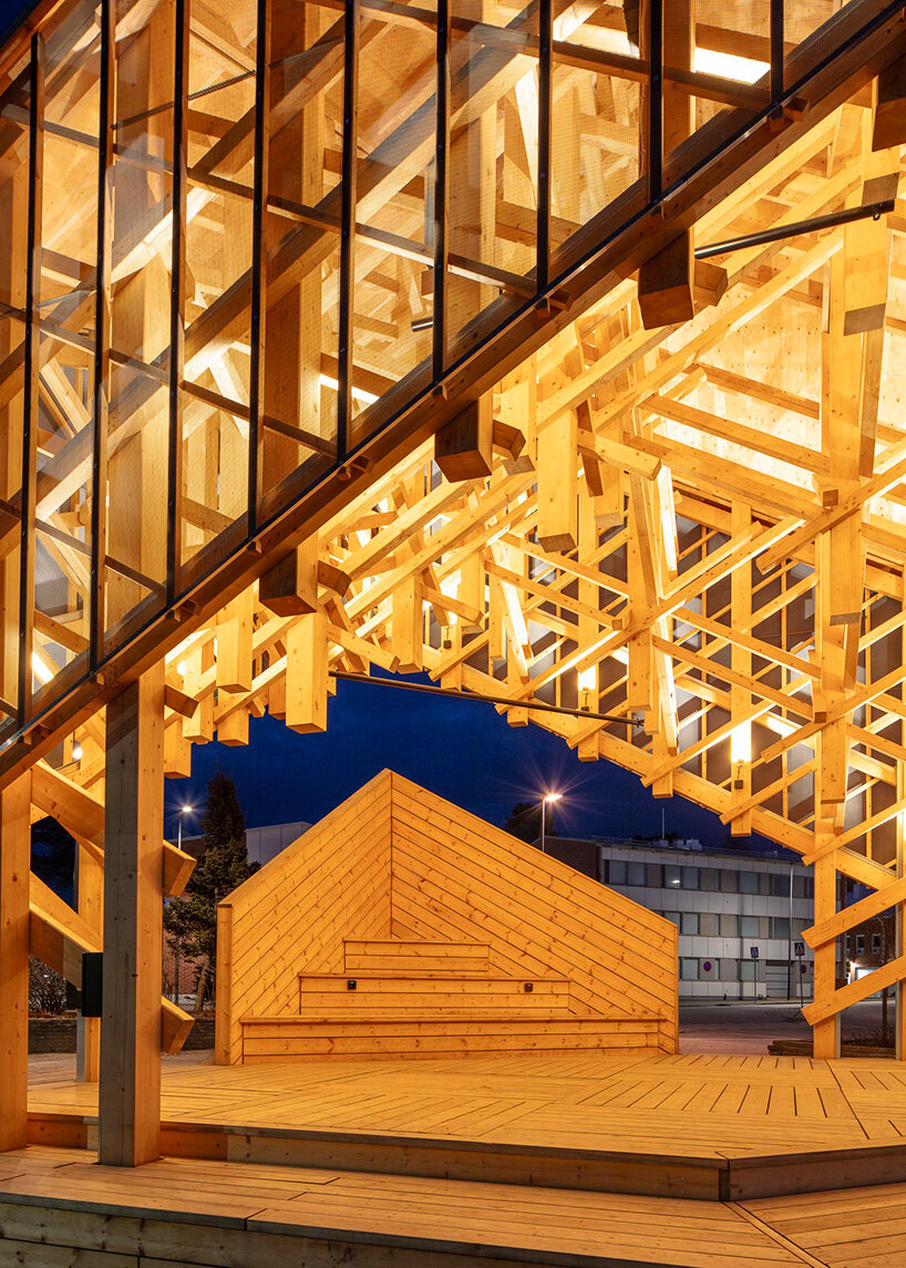 crystalline timber canopy inspired by snow fractals becomes a gathering space in finland