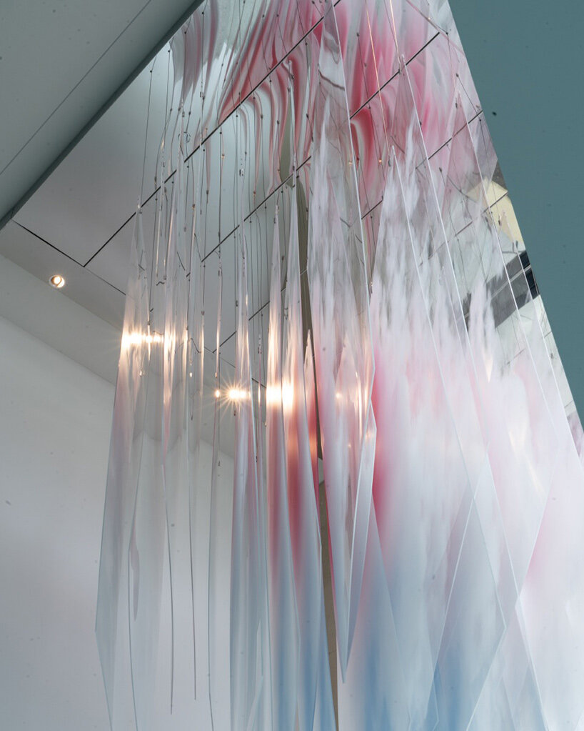 artist david spriggs suspends 'astra' installation as an ephemeral cloud of transparent planes