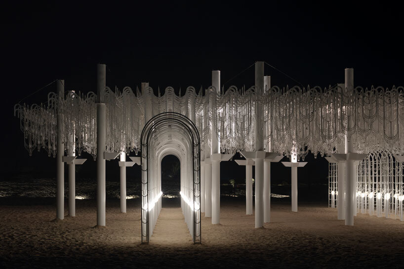 cloud-like white canopy of hanging vines emerges from abu dhabi&rsquo;s arid landscape