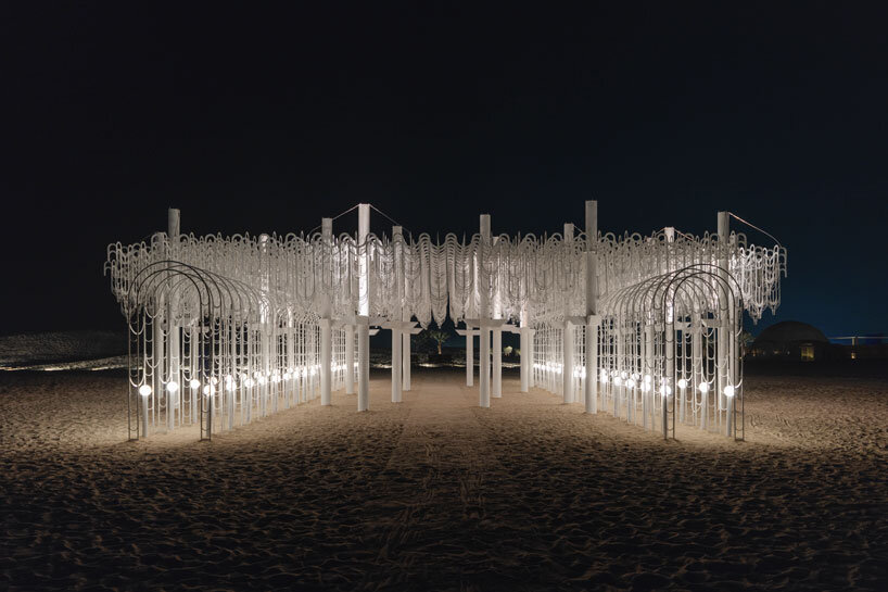 cloud-like white canopy of hanging vines emerges from abu dhabi&rsquo;s arid landscape